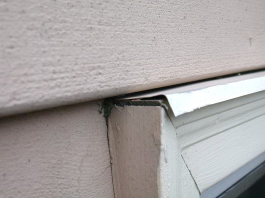 C:\Users\Owner\Desktop\Newsletters\Healthy Indoors Magazine\2019\Pics for Moisture Moisture Everwhere\Water flowed to the end of the flashing into the miter joint and rotted the trim and framing..JPG